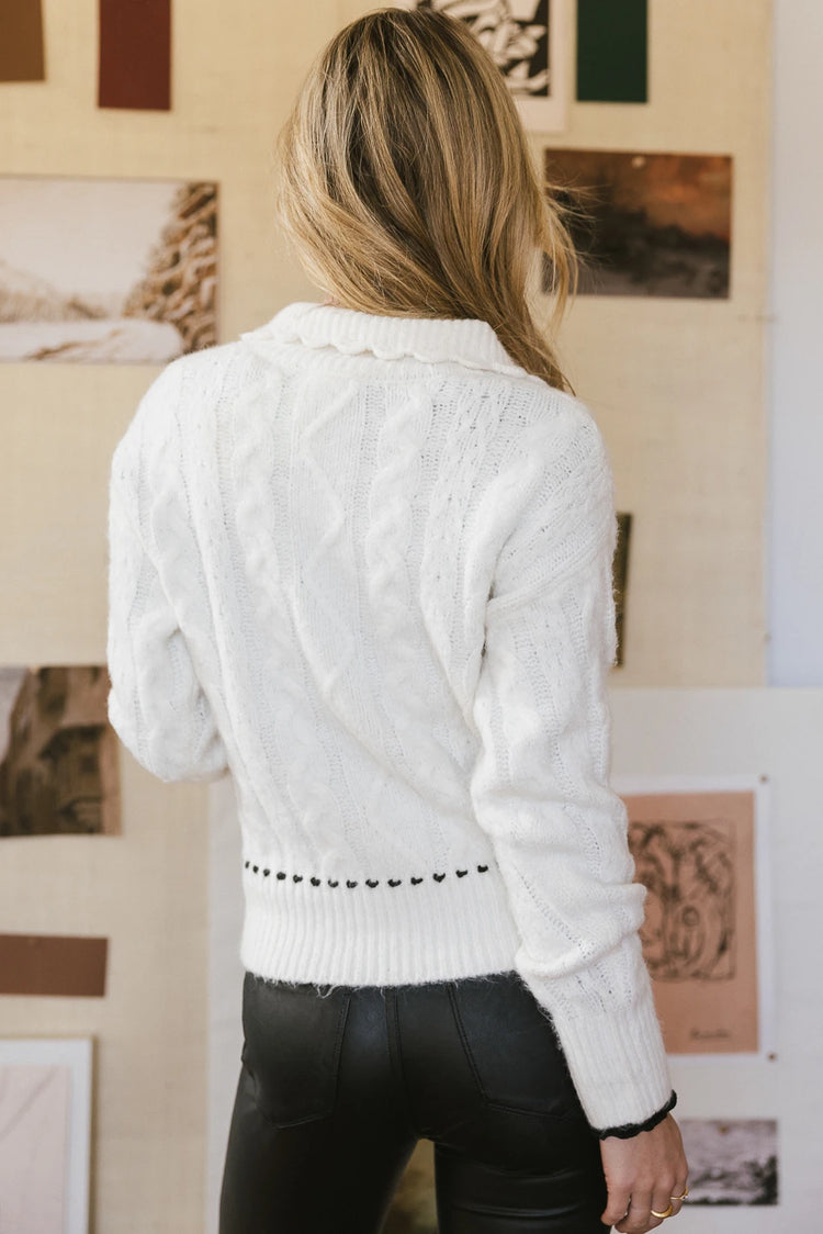 Ribbed hem cable knit sweater in cream 