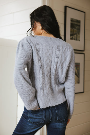 Wavy hem sweater in blue 