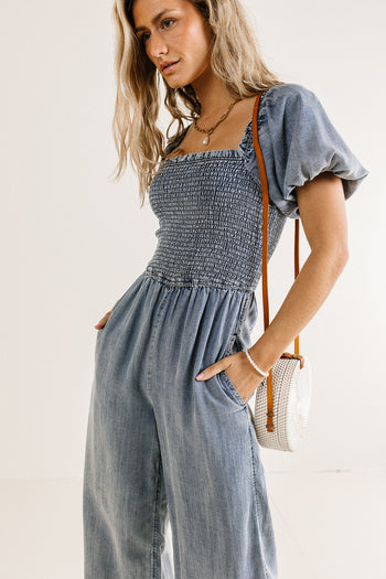 denim smocked jumpsuit with pockets