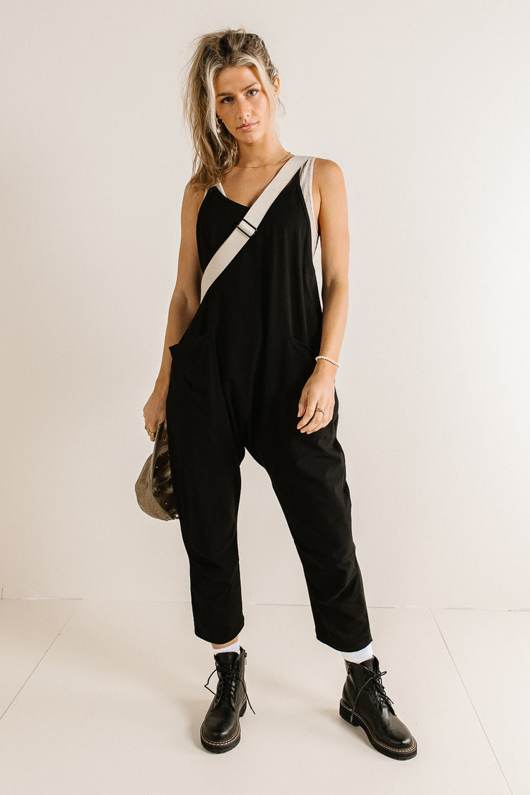 black sleeveless onsie with pockets
