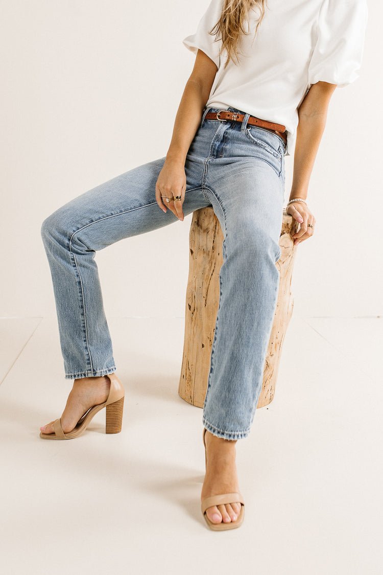 Straight leg denim jeans paired with a white top