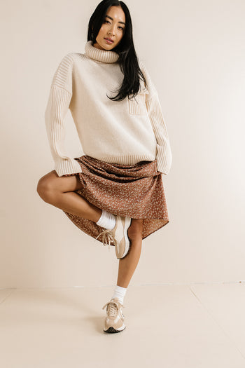 cream turtleneck with ribbed detail 