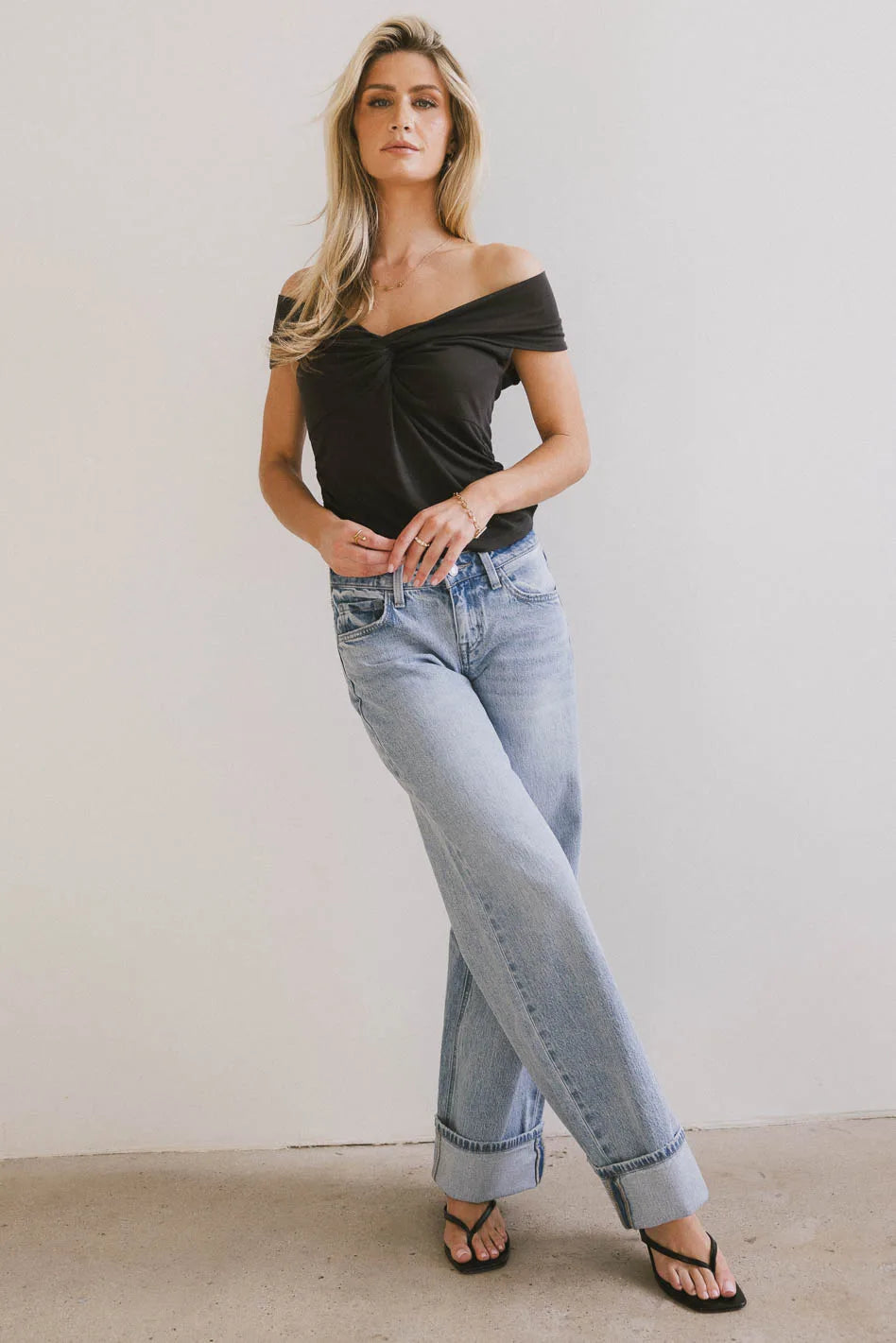 Top in black paired with a light wash denim 