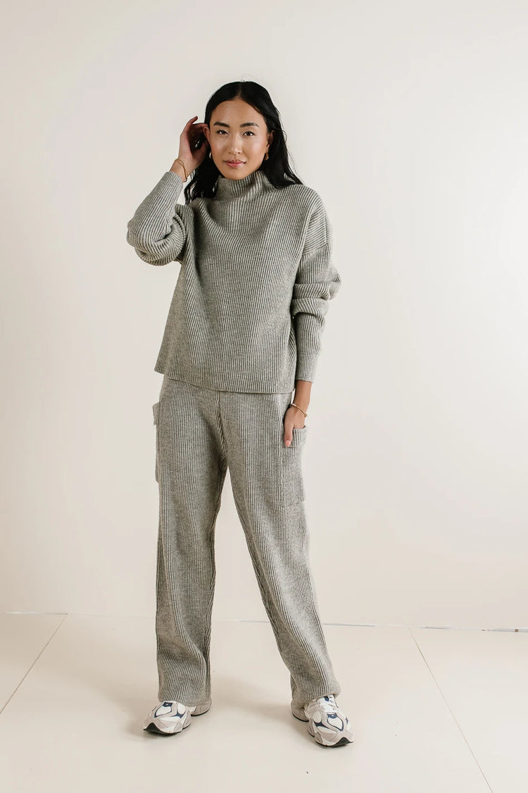 Mock neck sweater paired with a pant in grey 