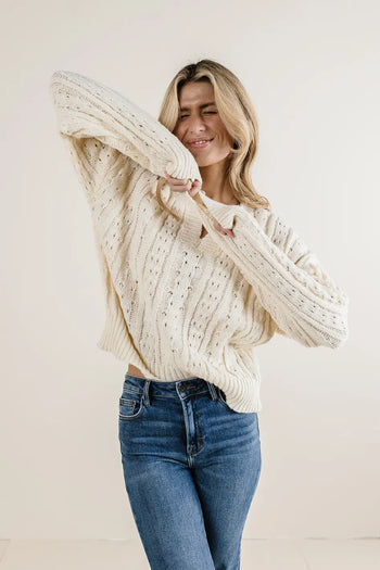 Ribbed hem knit sweater in cream 