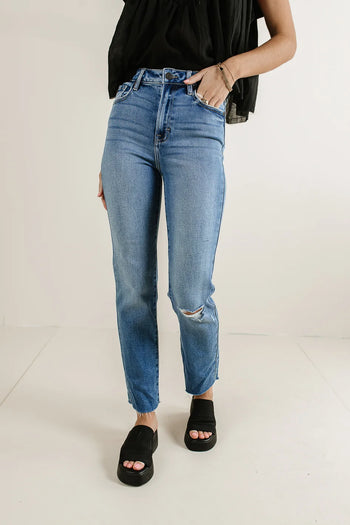 Distressed denim in medium wash 