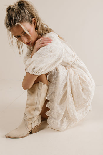 cream dress with lace embroidery