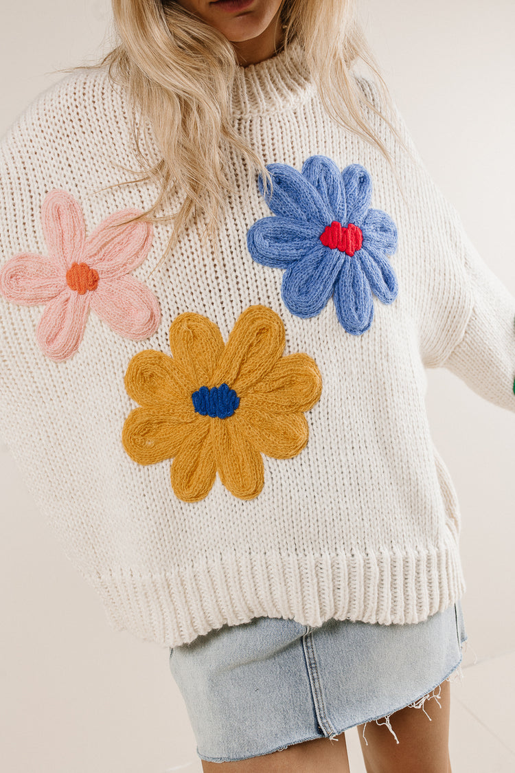 ivory knit sweater with floral embroidery