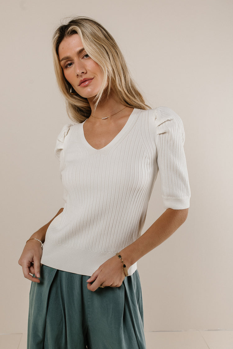 white ribbed knit blouse
