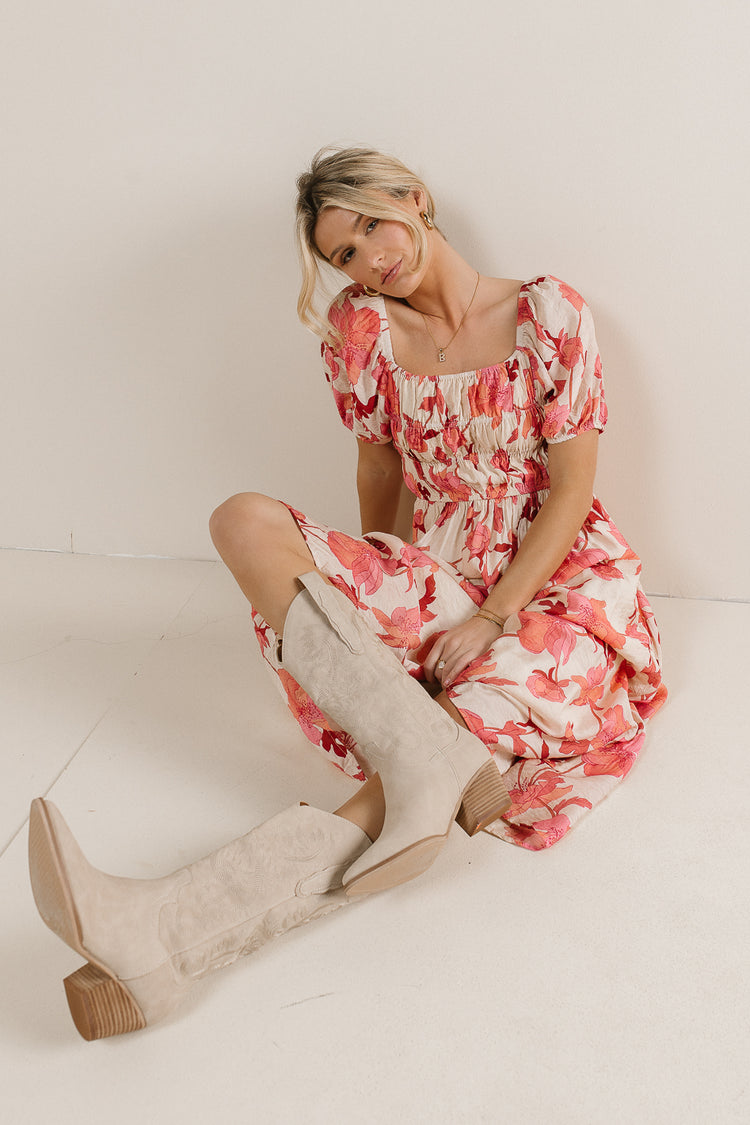 cream and pink dress with cowgirl boots