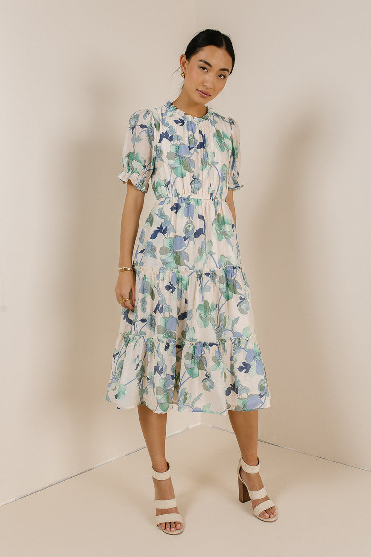 cream midi dress with green and blue flowers