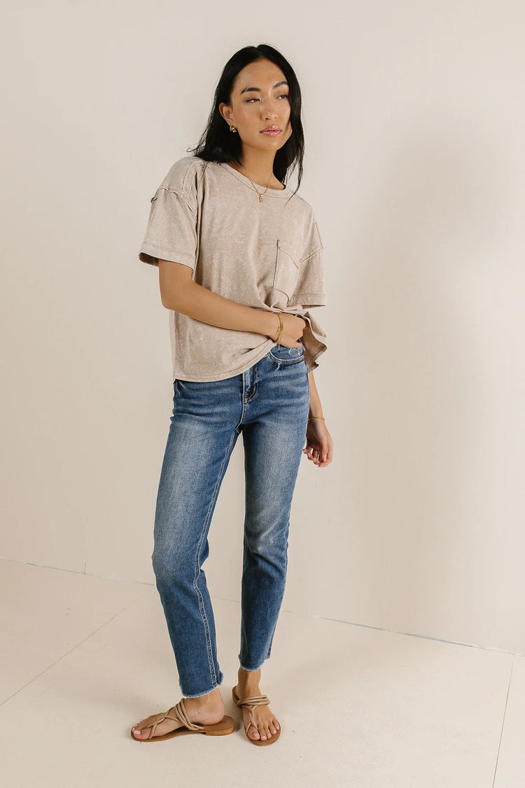 Top paired with a medium wash denim 
