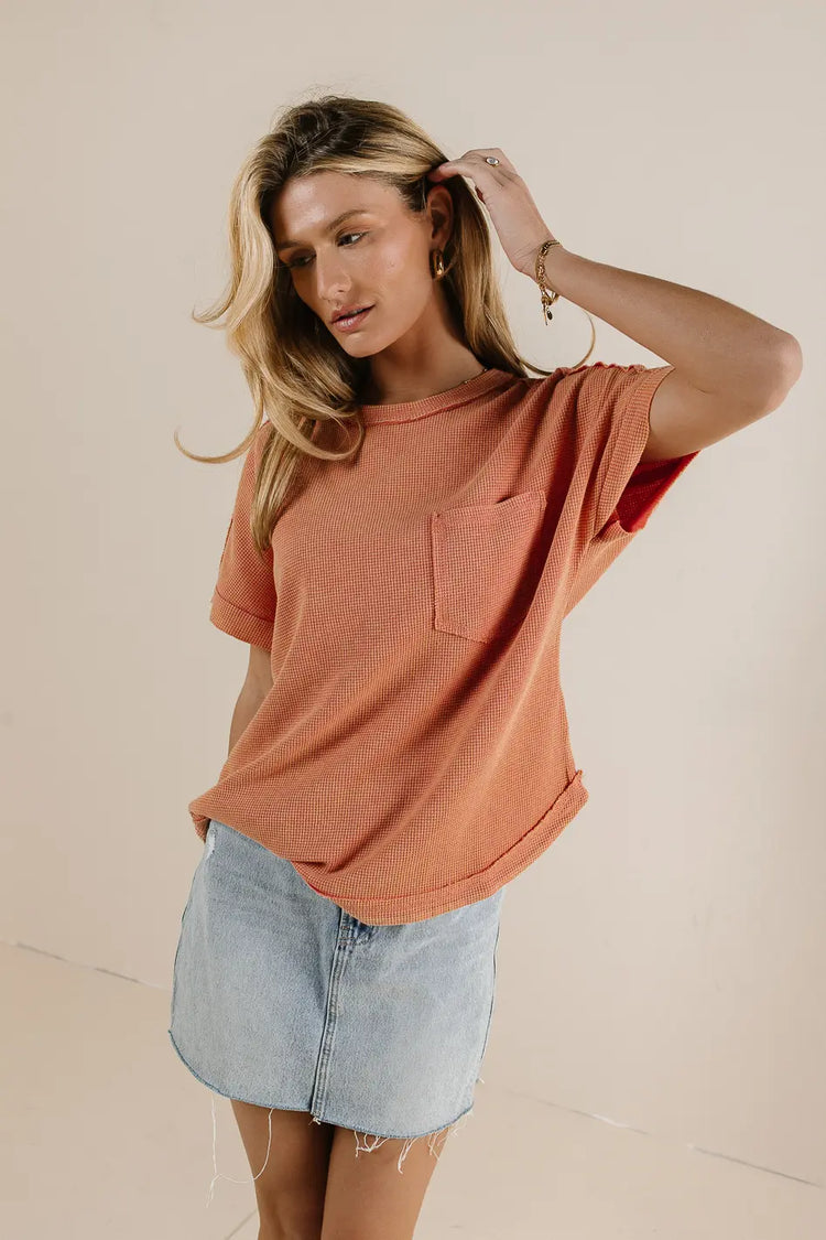 One side pocket top in coral 