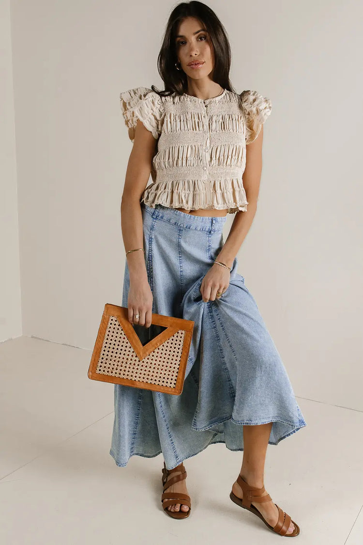 Denim skirt with a taupe top 