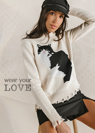 Sweaters so cute, they have cats on them!