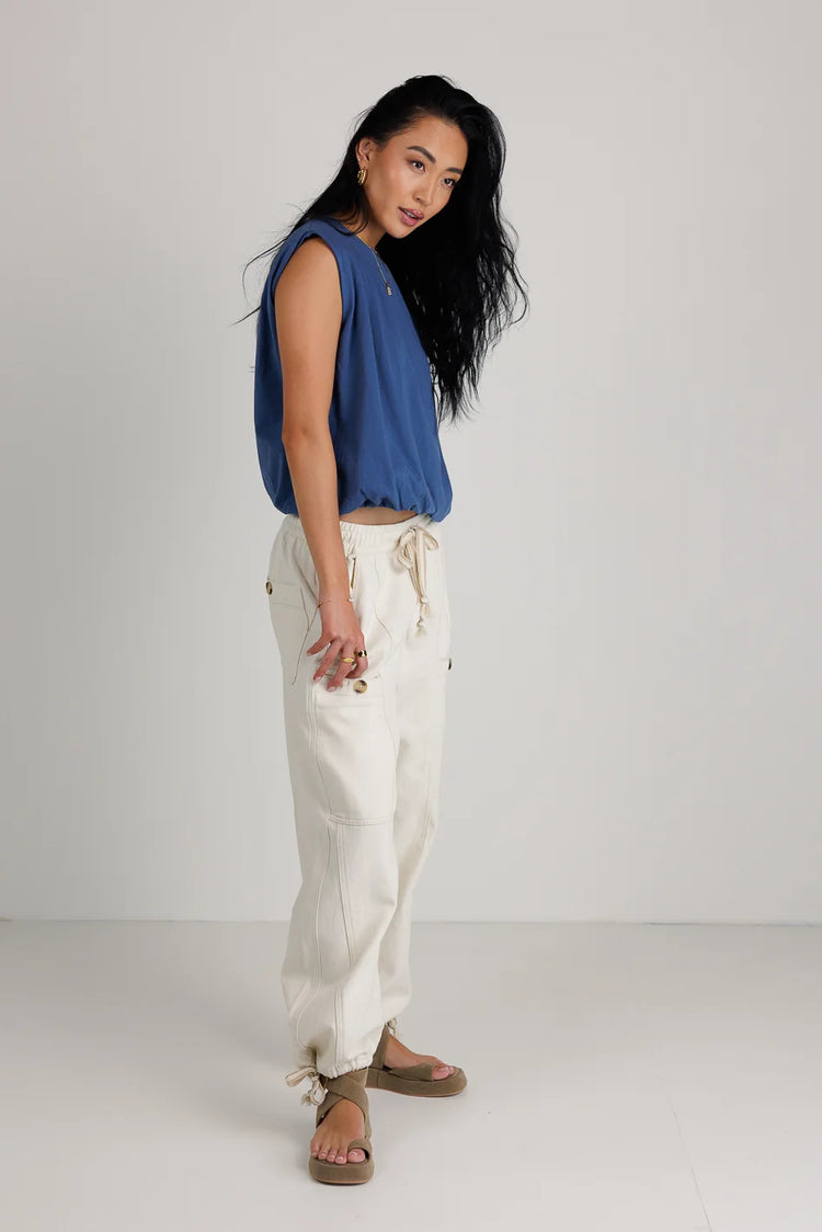 Top paired with a cream cargo pant