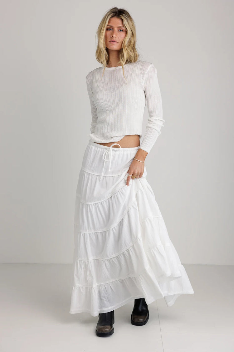 Top in white paired with a white skirt 