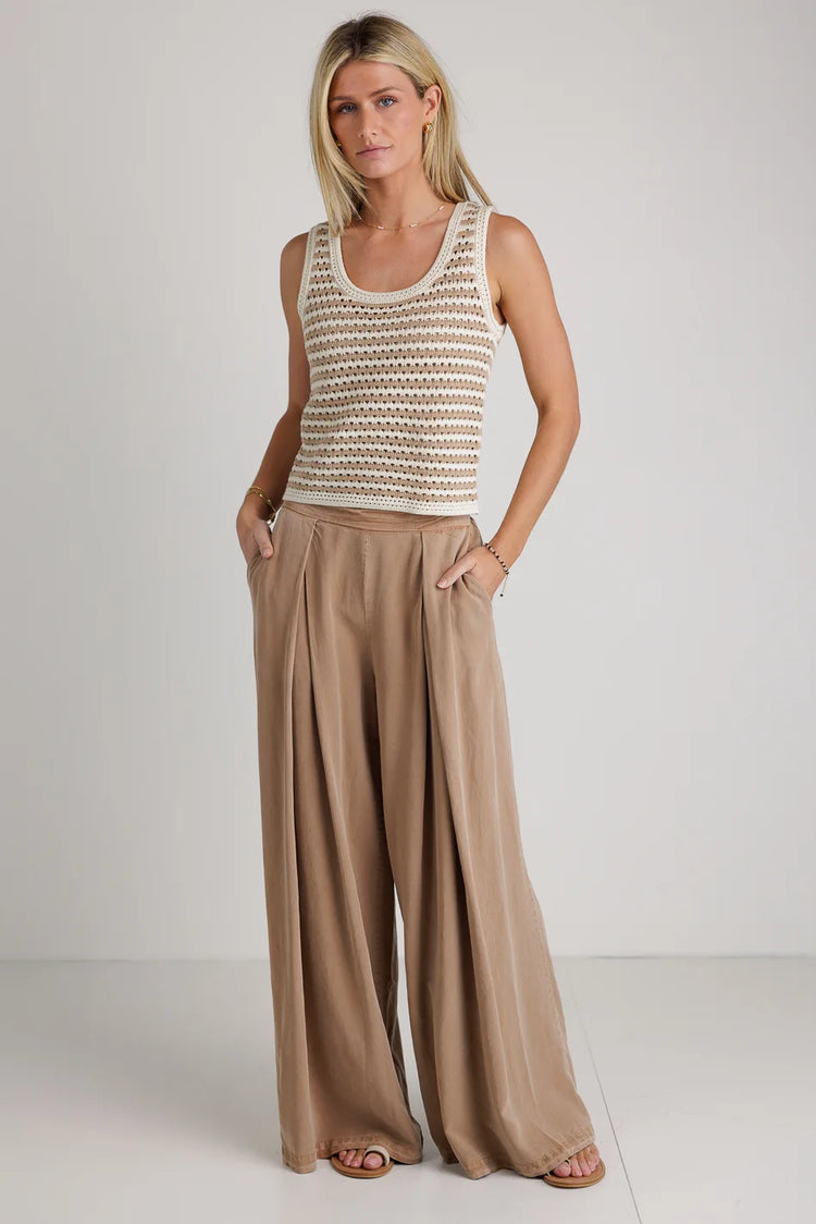 Crochet top in taupe paired with a wide leg pant 