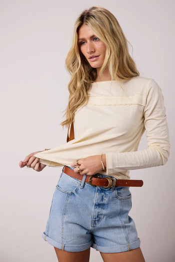 Front ruffled detailed top in cream 