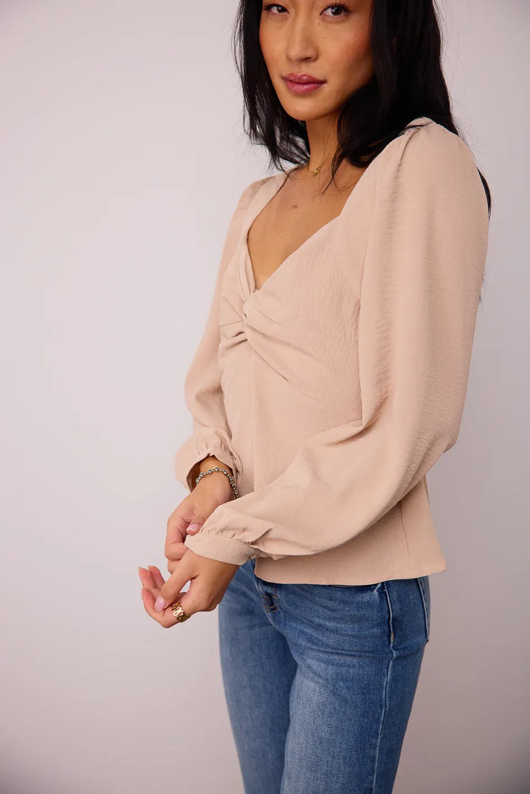Long sleeves button cuff detailed top in beige 