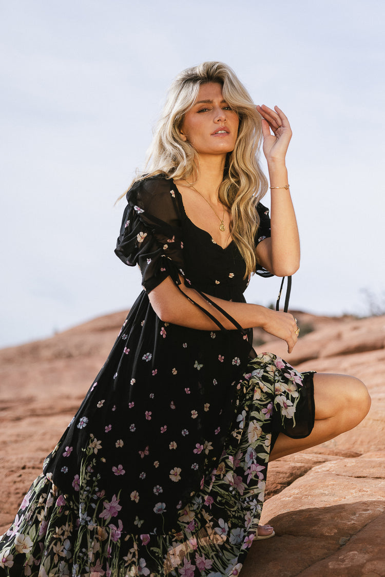black floral dress with ruched sleeve