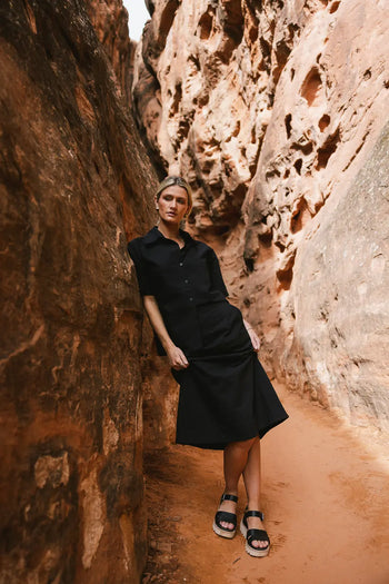 Woven textured skirt in black paired with a button up 