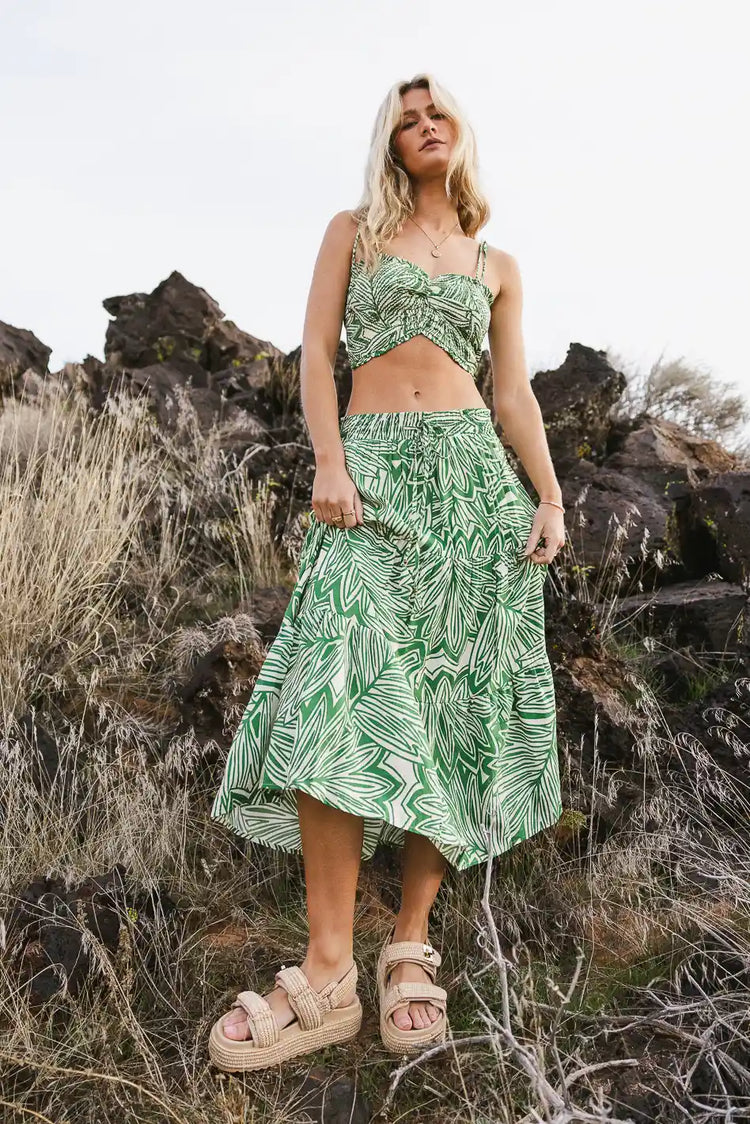 Printed skirt in green paired with a crop top 