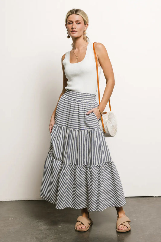 Top paired with a striped skirt 