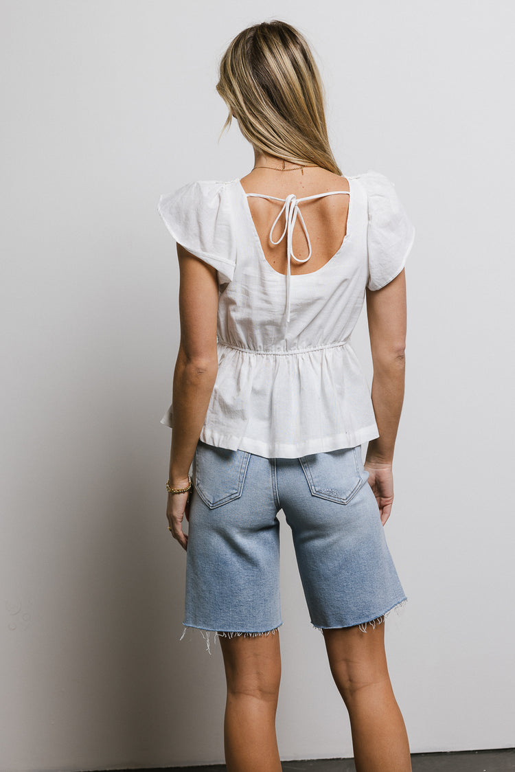 white peplum top with back tie