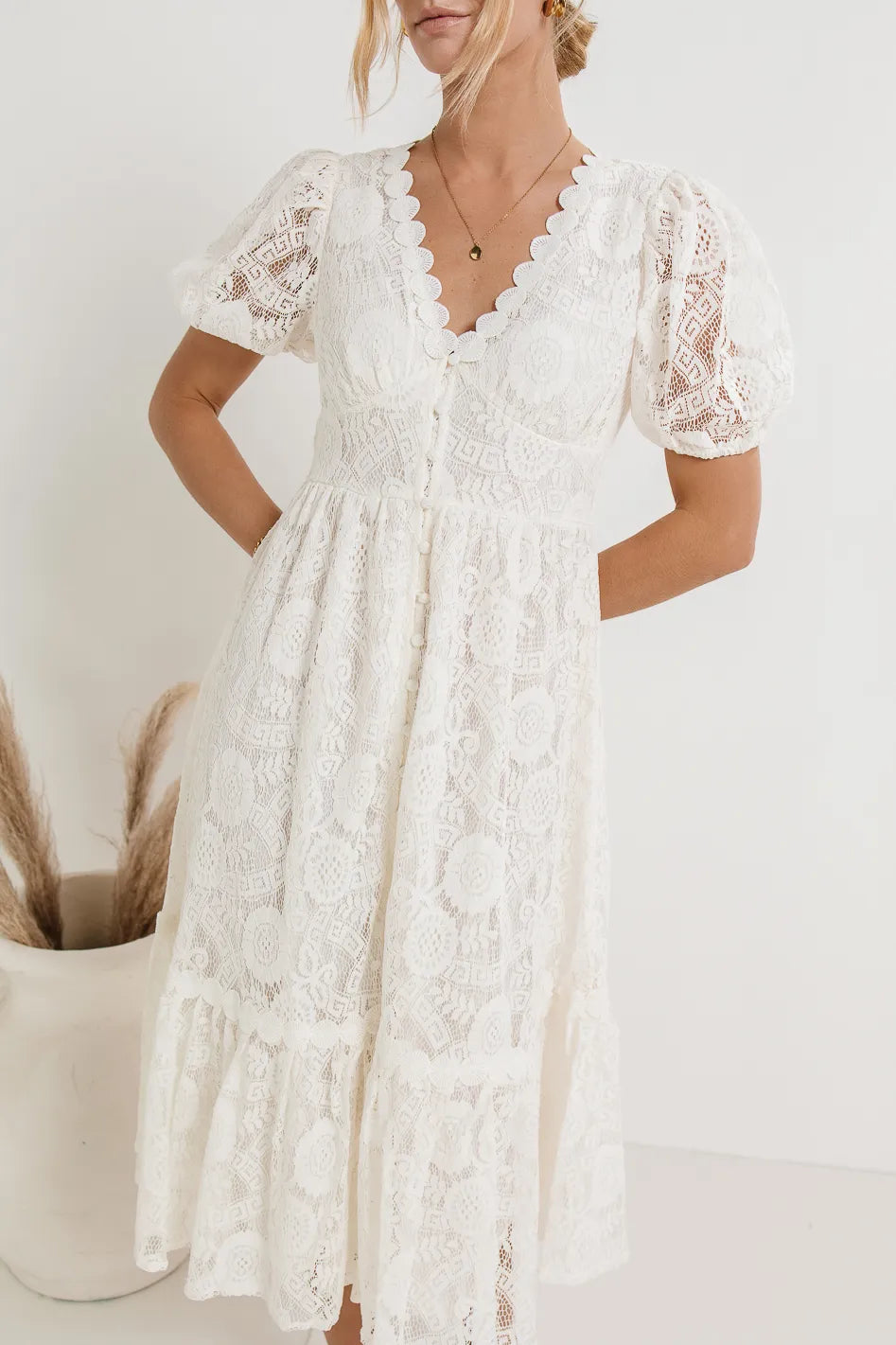 scalloped V-neckline