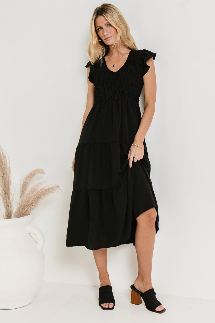 black midi dress with ruffle sleeve