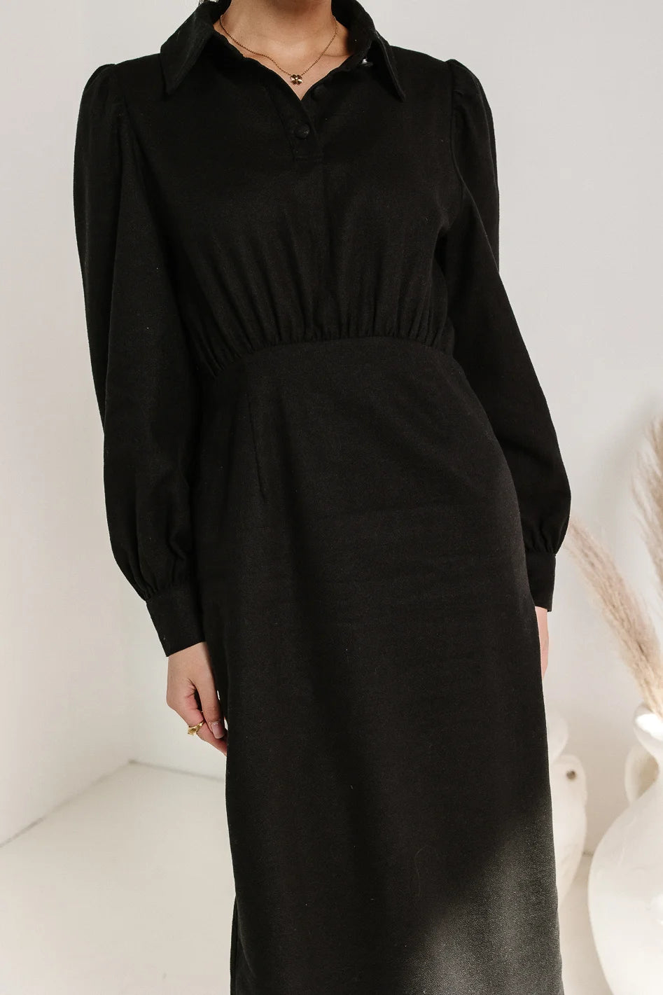 front button detail on black dress