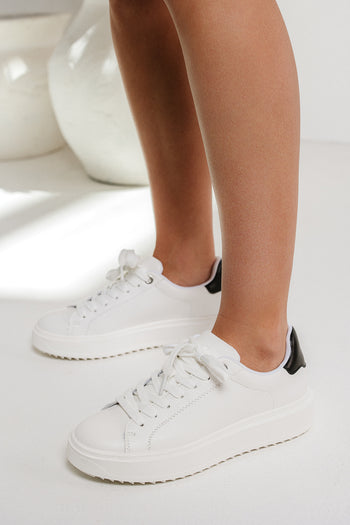 white and black platform sneakers