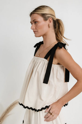 Wavy hem styled top in cream 