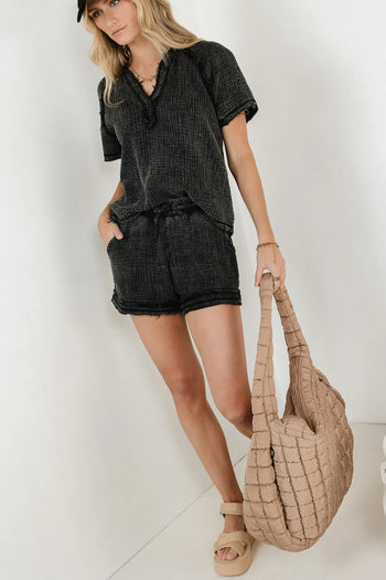 Black shorts paired with a black top 