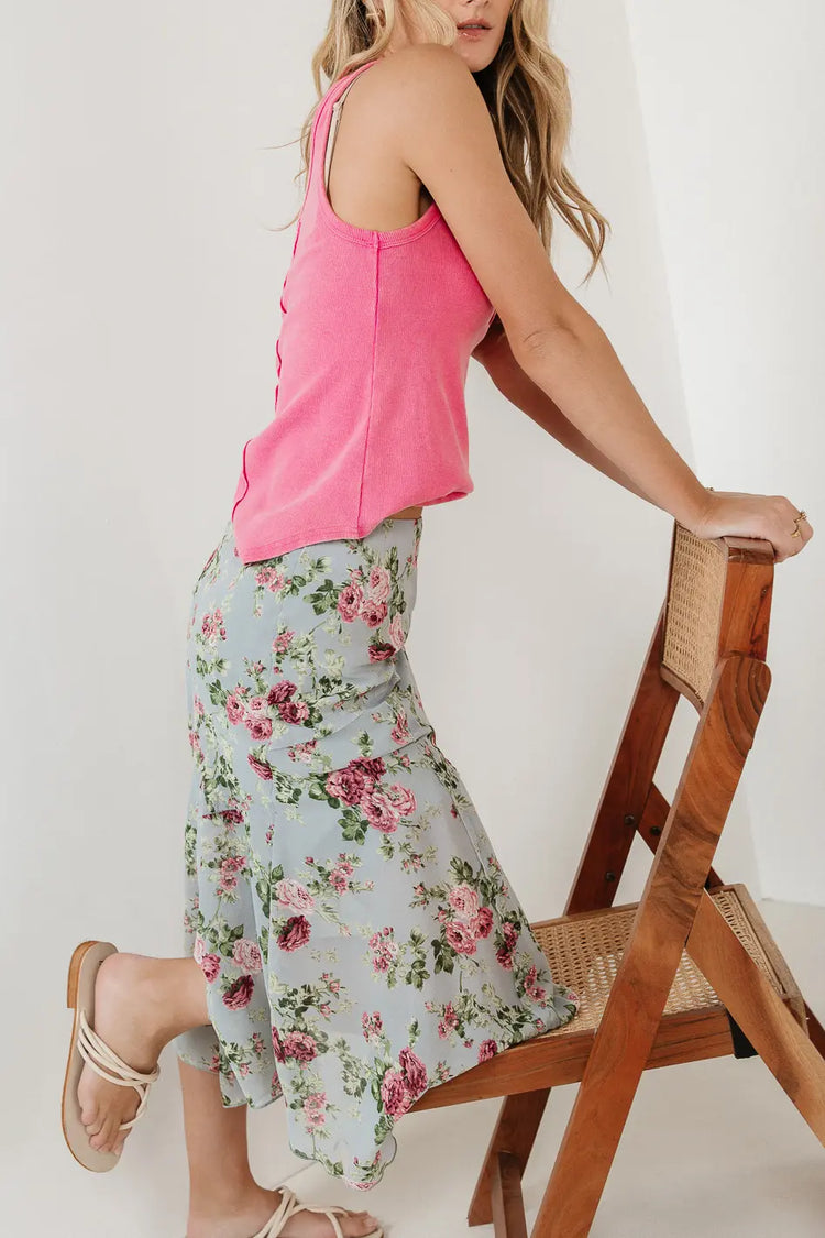 Floral skirt paired with a pink tank 