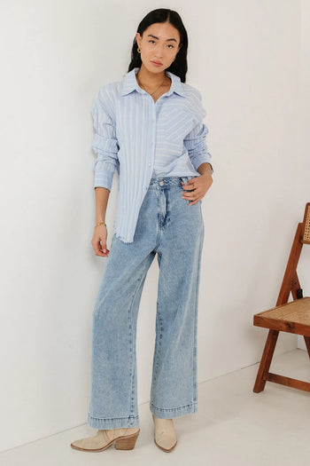 Button up paired with light denim jean 