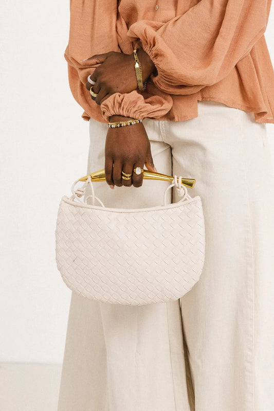 Gold handle bag in cream 