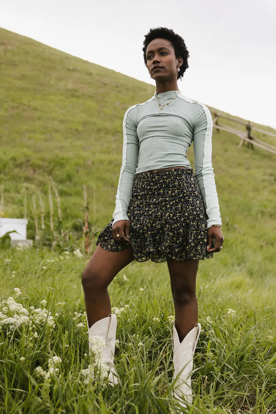 Top in sage paired with a floral mini skirt in multi color 
