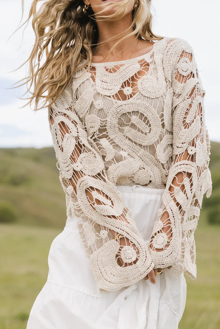 Crochet top paired with a maxi tiered skirt in white 