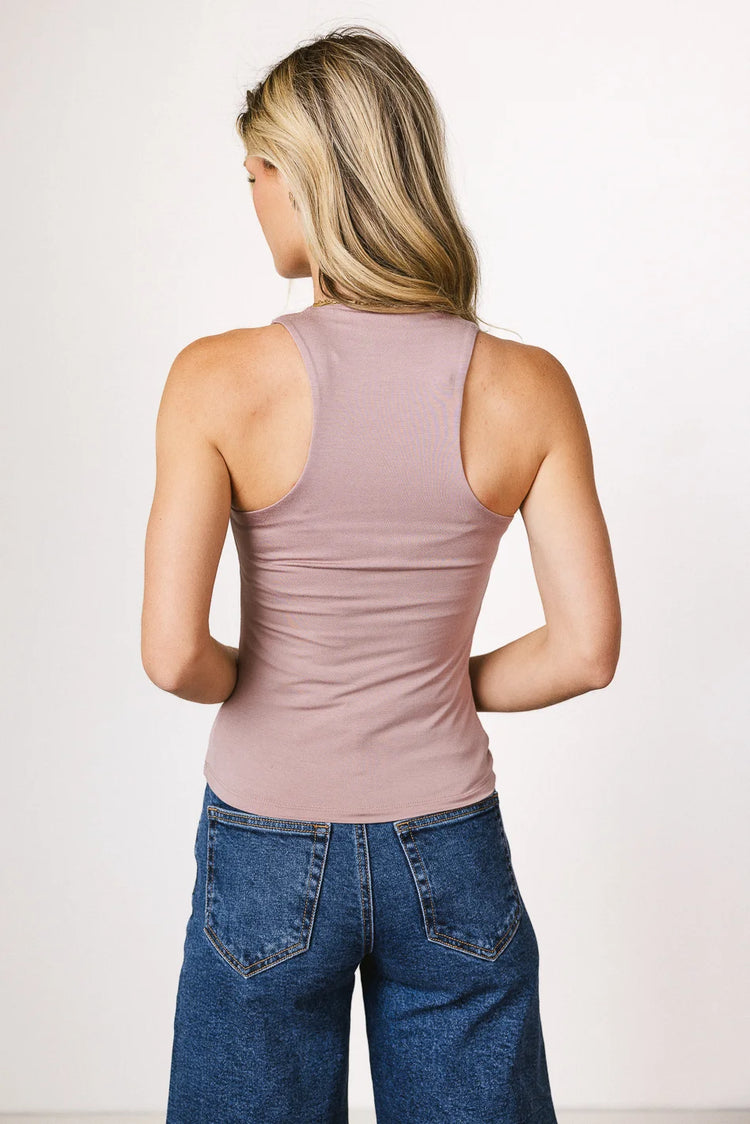 Tank top in mauve paired with a medium wash top 