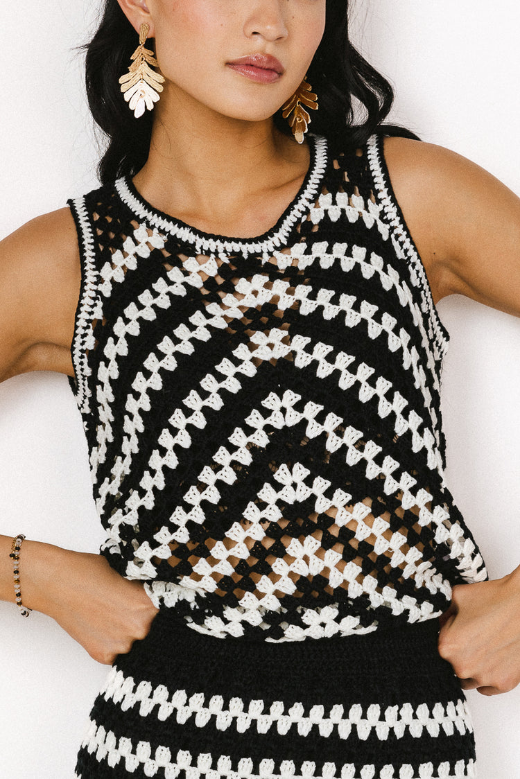 black and with crochet sweater vest