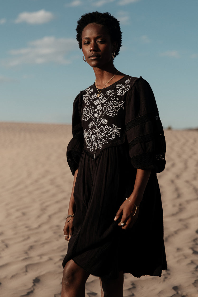 black mini dress with lace and embroidery detail