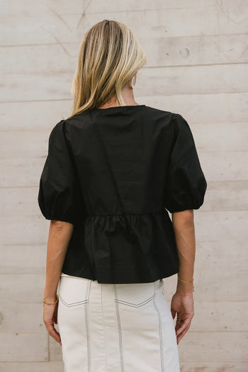 Ruffled hem top in black 