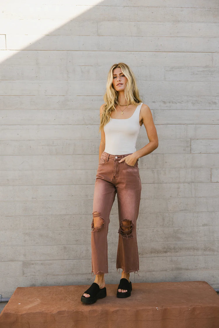 Denim in mauve paired with a tank in grey 