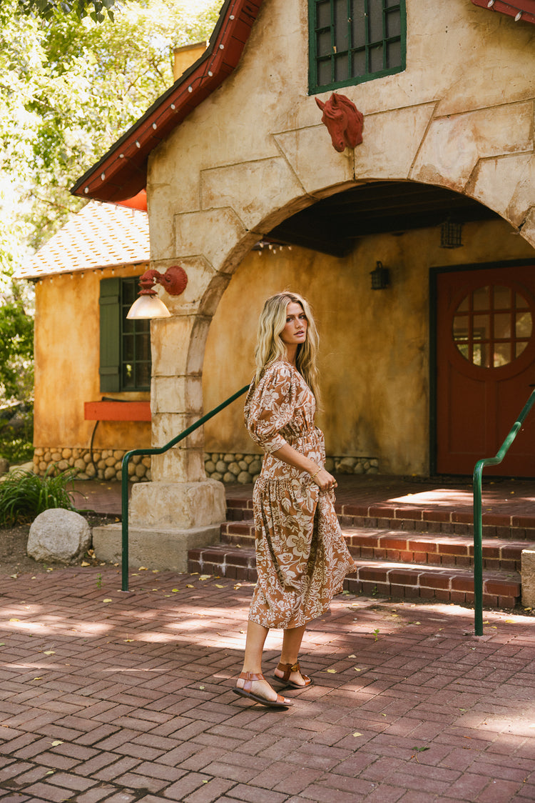 brown and cream printed dress with waist tie