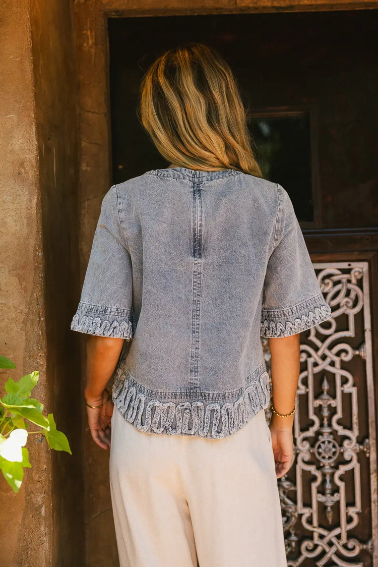 Embroidered hem designed denim top 