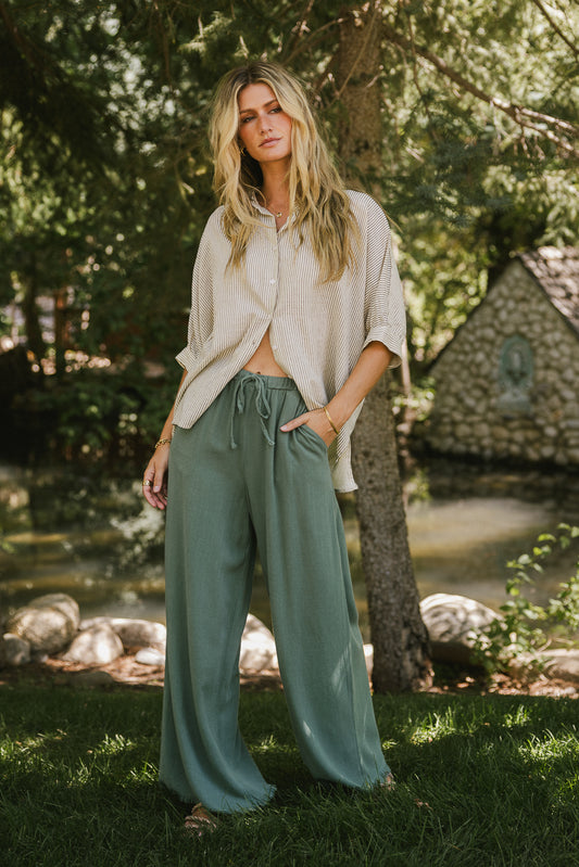 striped button up top with sage pants