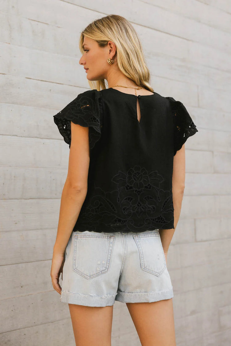 Embroidered hem blouse in black 