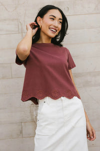 Embroidered hem top in wine 